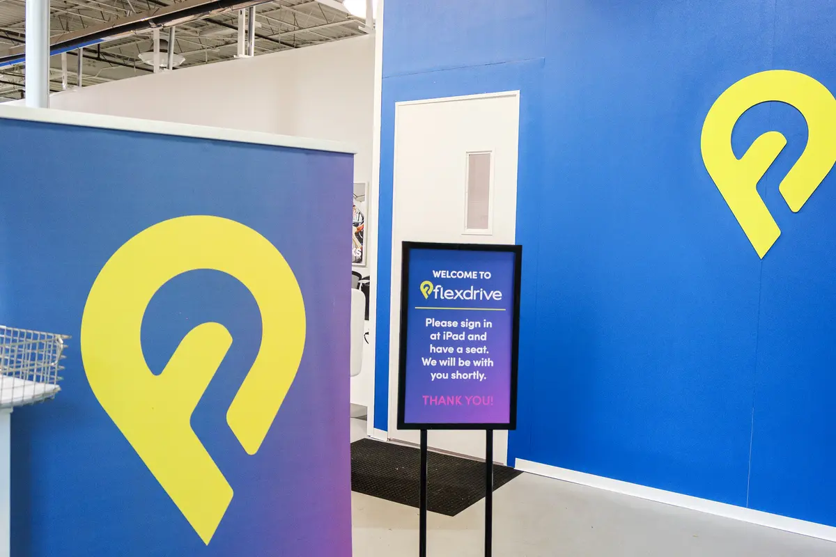 Finished commercial tenant improvement with a painted feature wall and branded signage