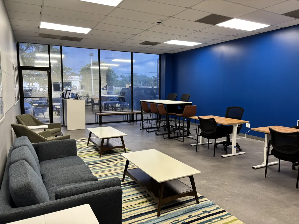Employee lounge with booth seating, soft furniture and a painted feature wall
