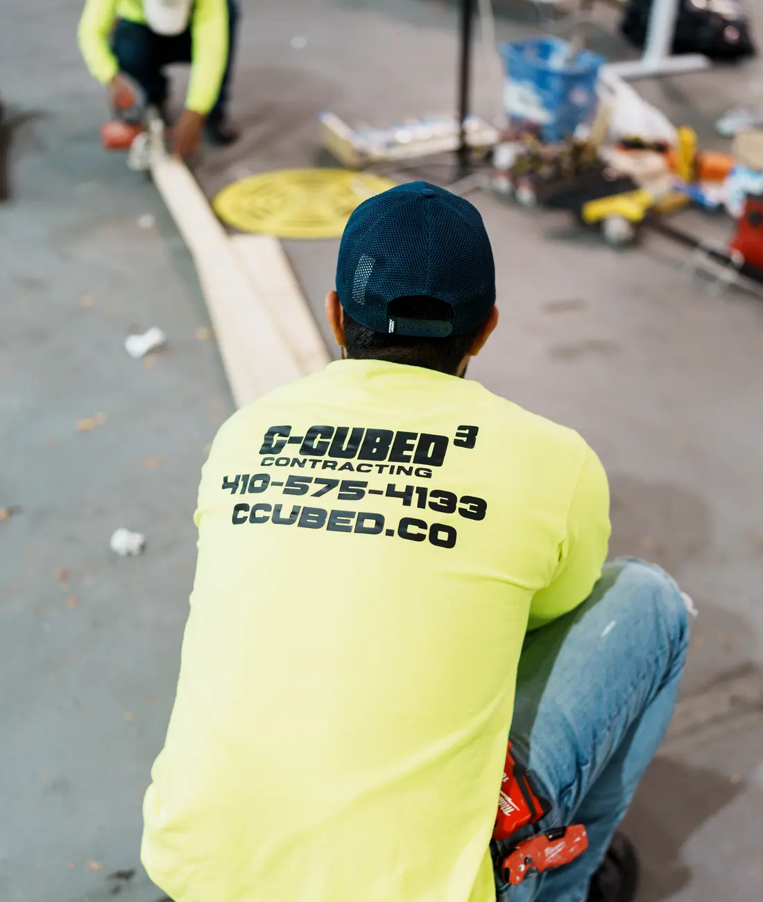C-Cubed Contracting team member cutting trim on a job site