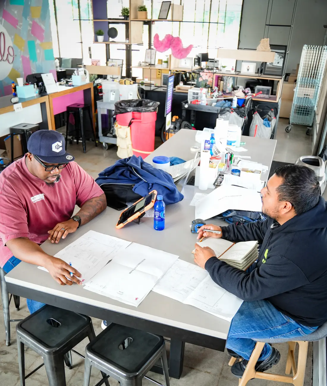 C-Cubed Contracting staff going through project drawings with a client
